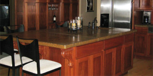 African Mahogany Kitchen Cabinetry With Concrete Countertops