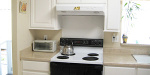 White Lacquer Cabinets with Modern Roll Laminate